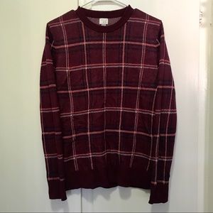 Maroon sweater with stripes.